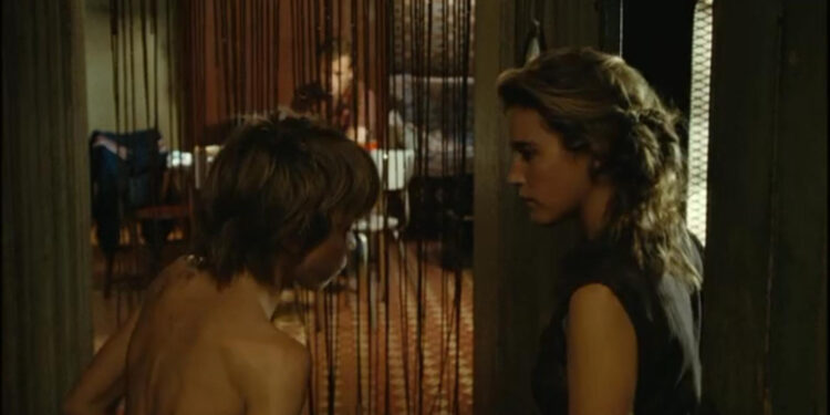 The Blonde with Bare Breasts